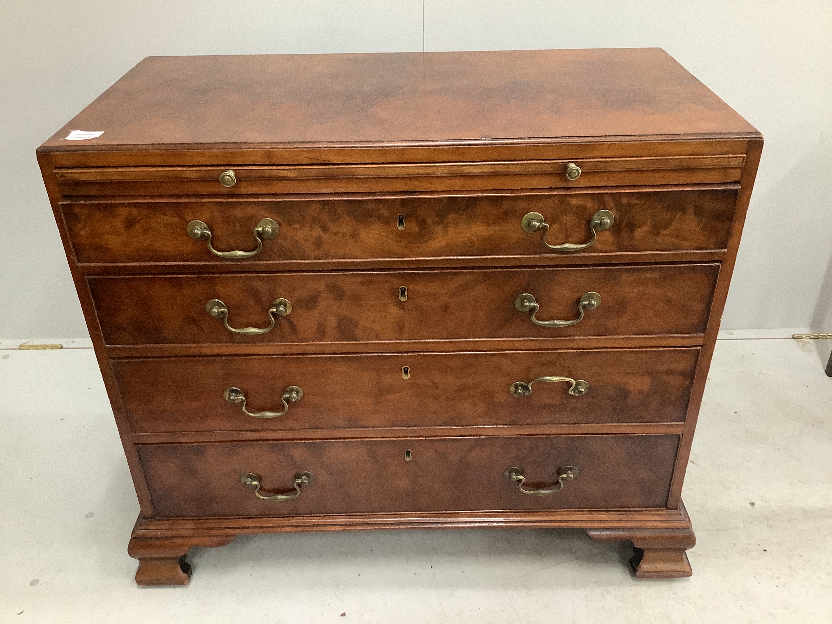 A George III mahogany four drawer chest with brushing slide, width 91cm, depth 46cm, height 80cm